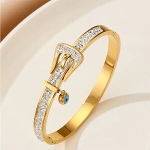 Golden Stainless Steel Bangle With Cubic Zirconia And Blue Evil Eye